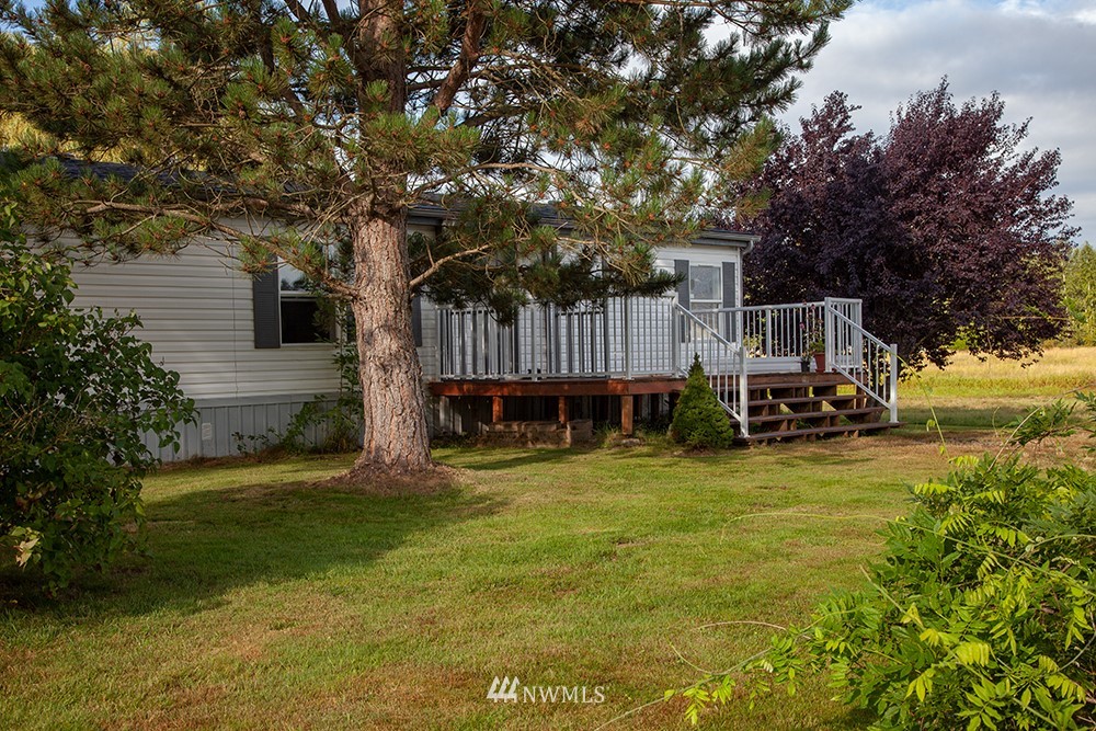 2977 East Smith Road Bellingham, WA 98226 - Photo 2 of 26 a view of a house with backyard and sitting area