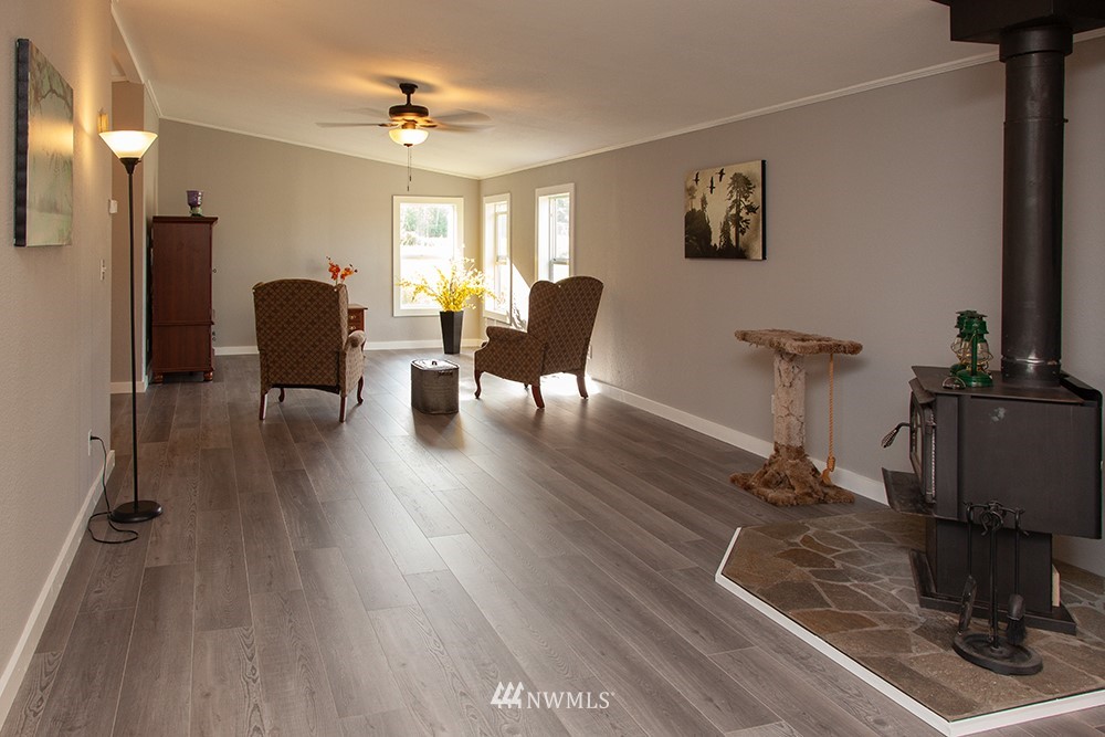 2977 East Smith Road Bellingham, WA 98226 - Photo 13 of 26 a living room with furniture and a wooden floor