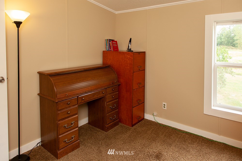 2977 East Smith Road Bellingham, WA 98226 - Photo 16 of 26 a room with cabinets and a dresser
