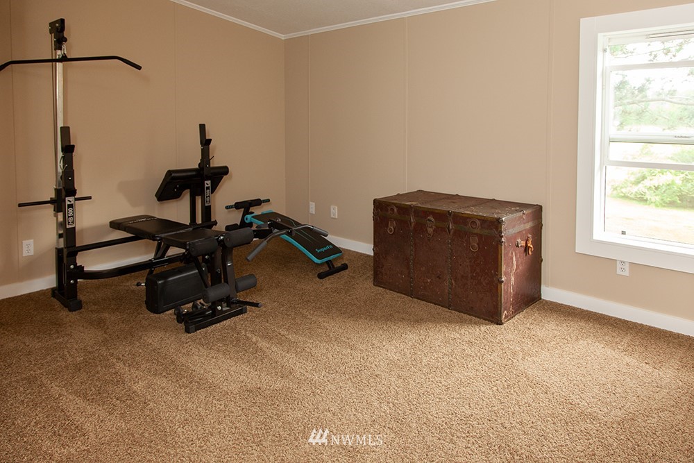 2977 East Smith Road Bellingham, WA 98226 - Photo 18 of 26 a room with gym equipment and a window
