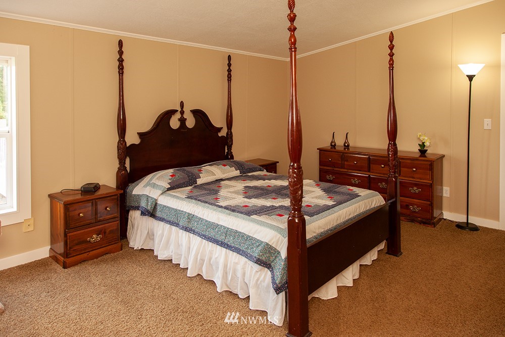 2977 East Smith Road Bellingham, WA 98226 - Photo 19 of 26 a bedroom with a bed window and dresser