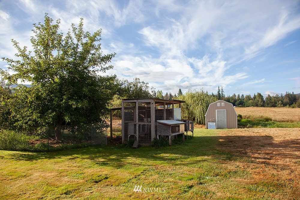 2977 East Smith Road Bellingham, WA 98226 - Photo 25 of 26 a view of a lake with a house in the background