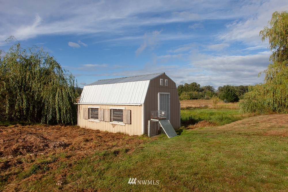 2977 East Smith Road Bellingham, WA 98226 - Photo 26 of 26 a view of a house with backyard and a tree