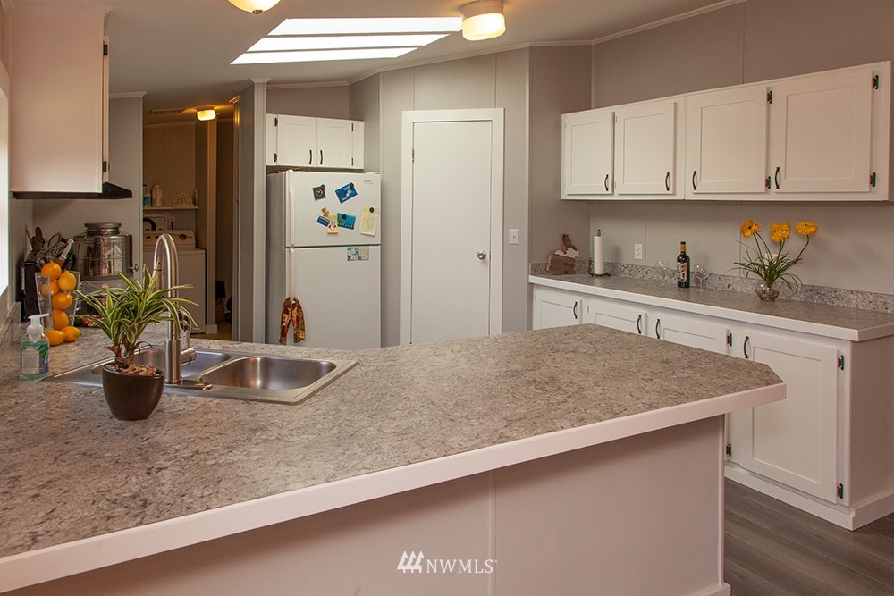 2977 East Smith Road Bellingham, WA 98226 - Photo 8 of 26 a kitchen with sink cabinets and appliances