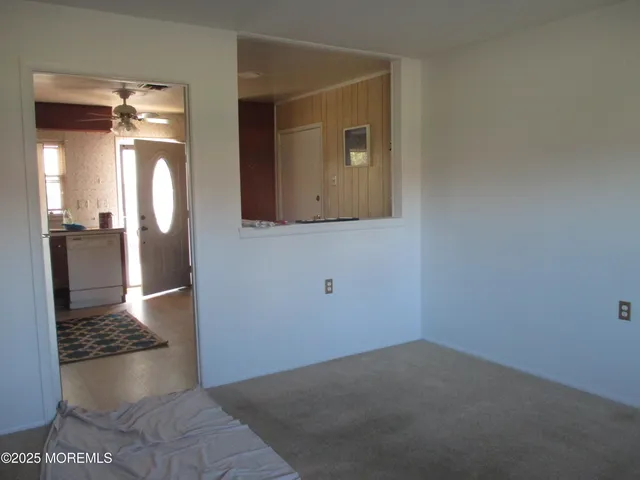 a kitchen with a refrigerator and cabinets