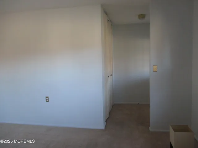 a view of a bathroom with a tub and mirror