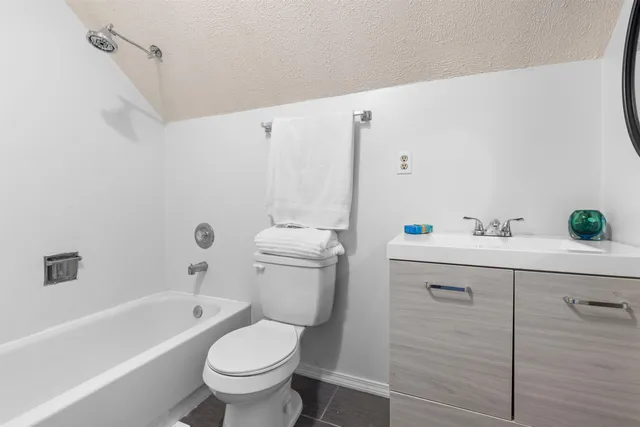 a bathroom with a sink a toilet and a bathtub
