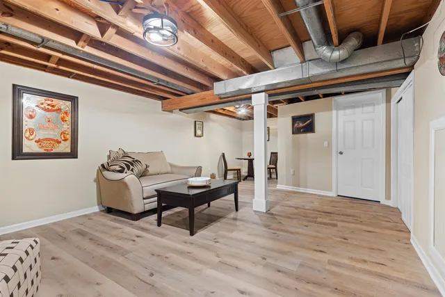 a workspace with furniture and wooden floor