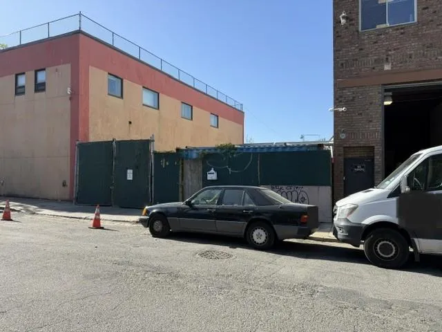a view of a car parked in front of a building