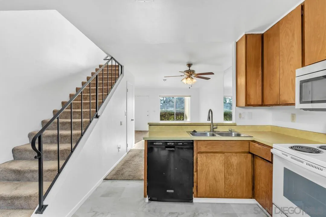 10258 Carefree Drive Santee, CA 92071 - Photo 12 of 30 a view of a kitchen with sink and wooden floor