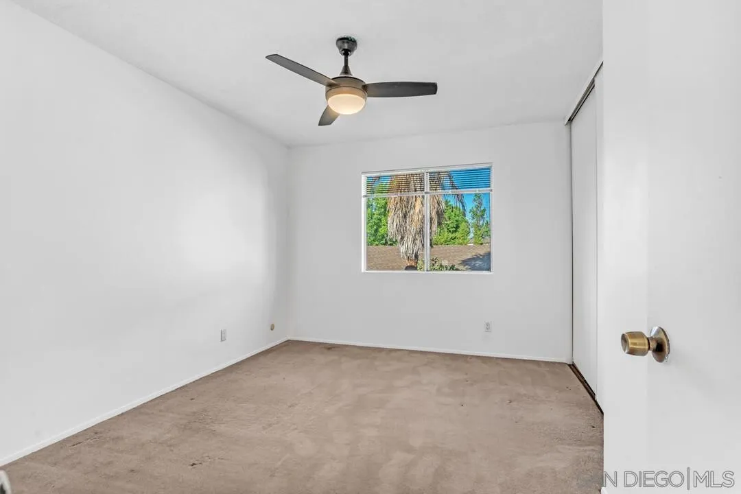10258 Carefree Drive Santee, CA 92071 - Photo 17 of 30 an empty room with windows and ceiling fan
