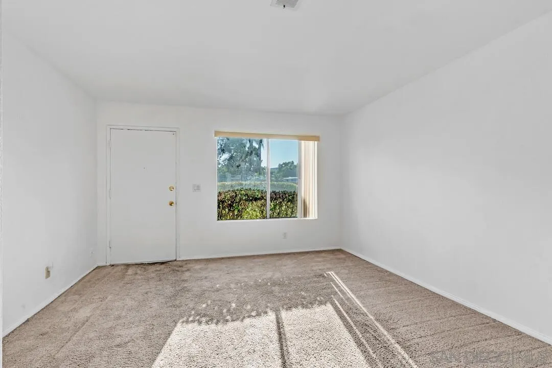 10258 Carefree Drive Santee, CA 92071 - Photo 3 of 30 an empty room with a window