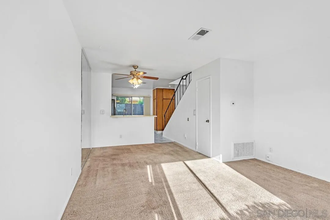 10258 Carefree Drive Santee, CA 92071 - Photo 7 of 30 a view of a bedroom with a bed and stairs
