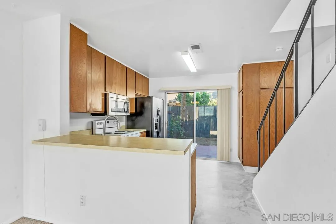 10258 Carefree Drive Santee, CA 92071 - Photo 9 of 30 a view of a kitchen from a living room