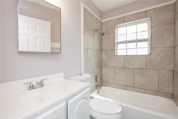 a bathroom with a sink toilet and bathtub