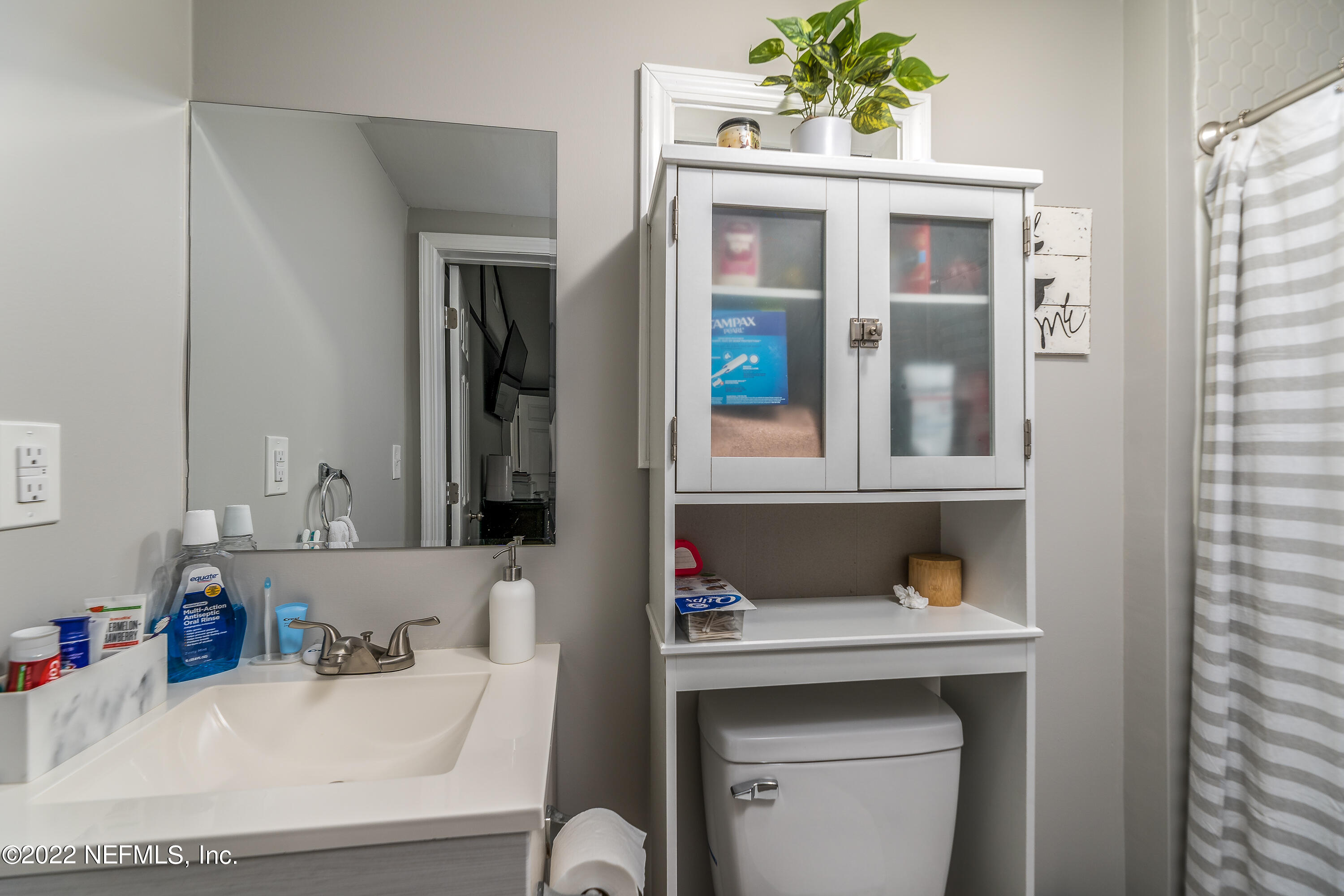5807 Ricker Road Jacksonville, FL 32244 - Photo 20 of 31 a bathroom with a sink and a window