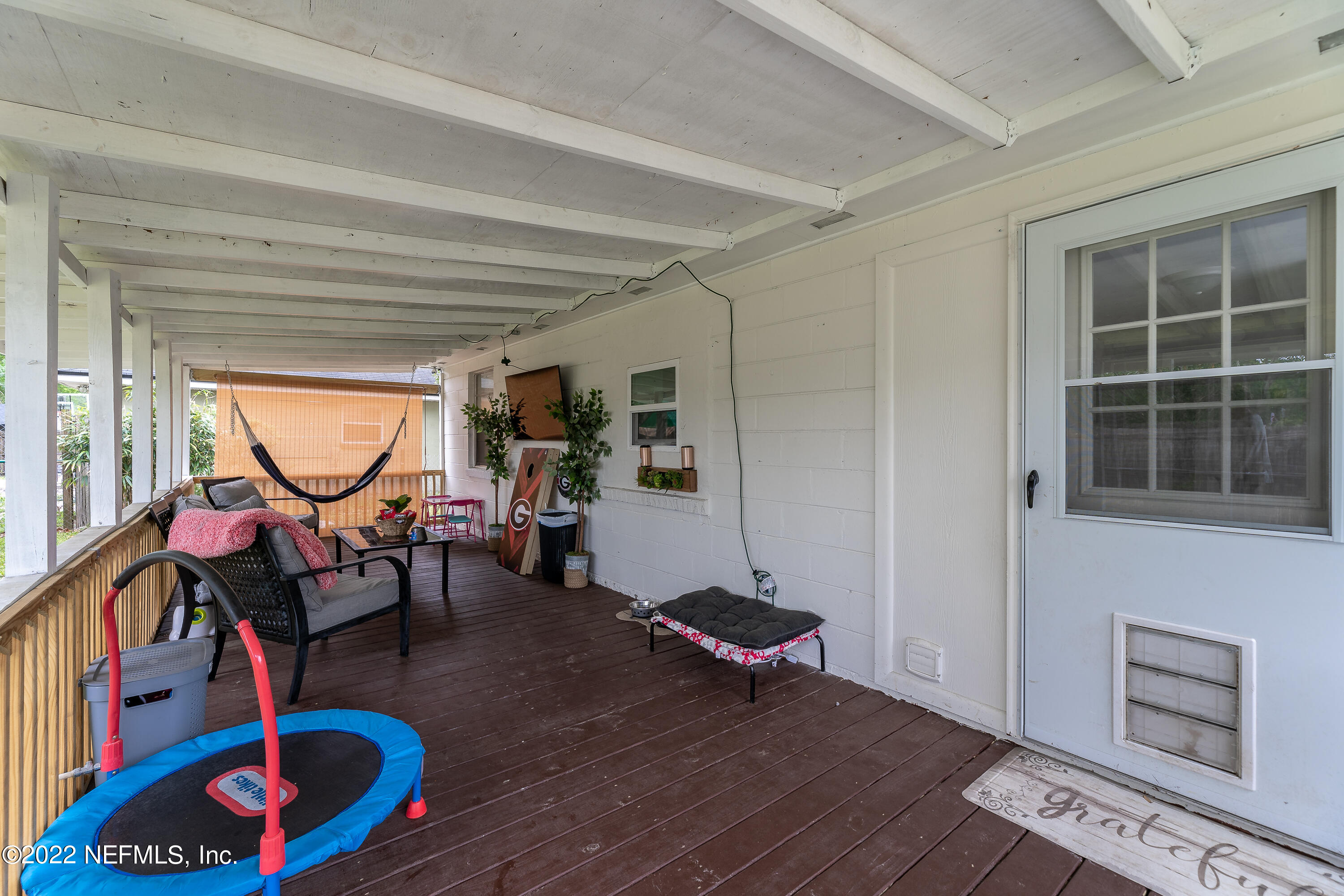 5807 Ricker Road Jacksonville, FL 32244 - Photo 26 of 31 a living room with furniture and a window