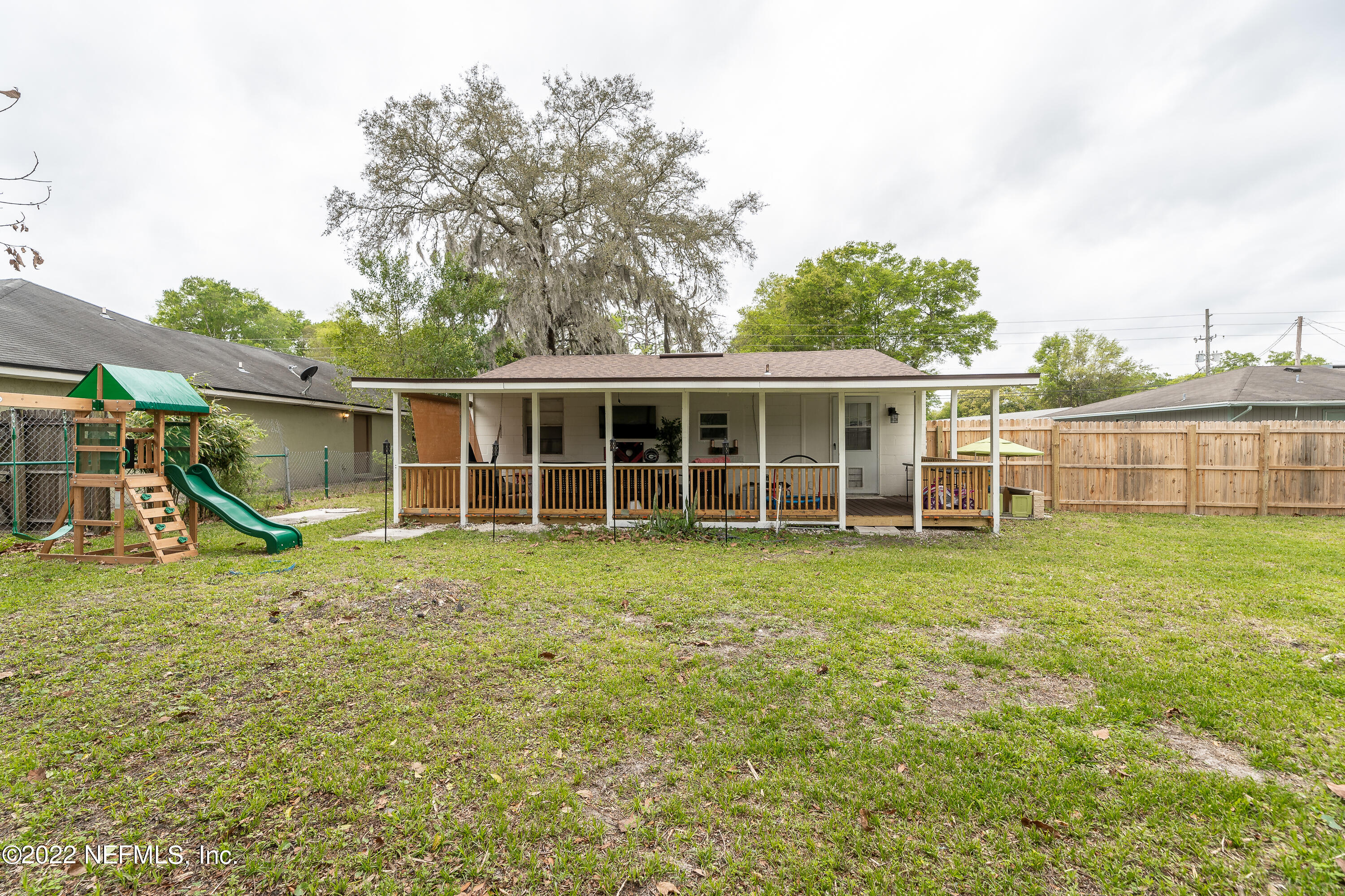 5807 Ricker Road Jacksonville, FL 32244 - Photo 30 of 31 a view of a house with a backyard