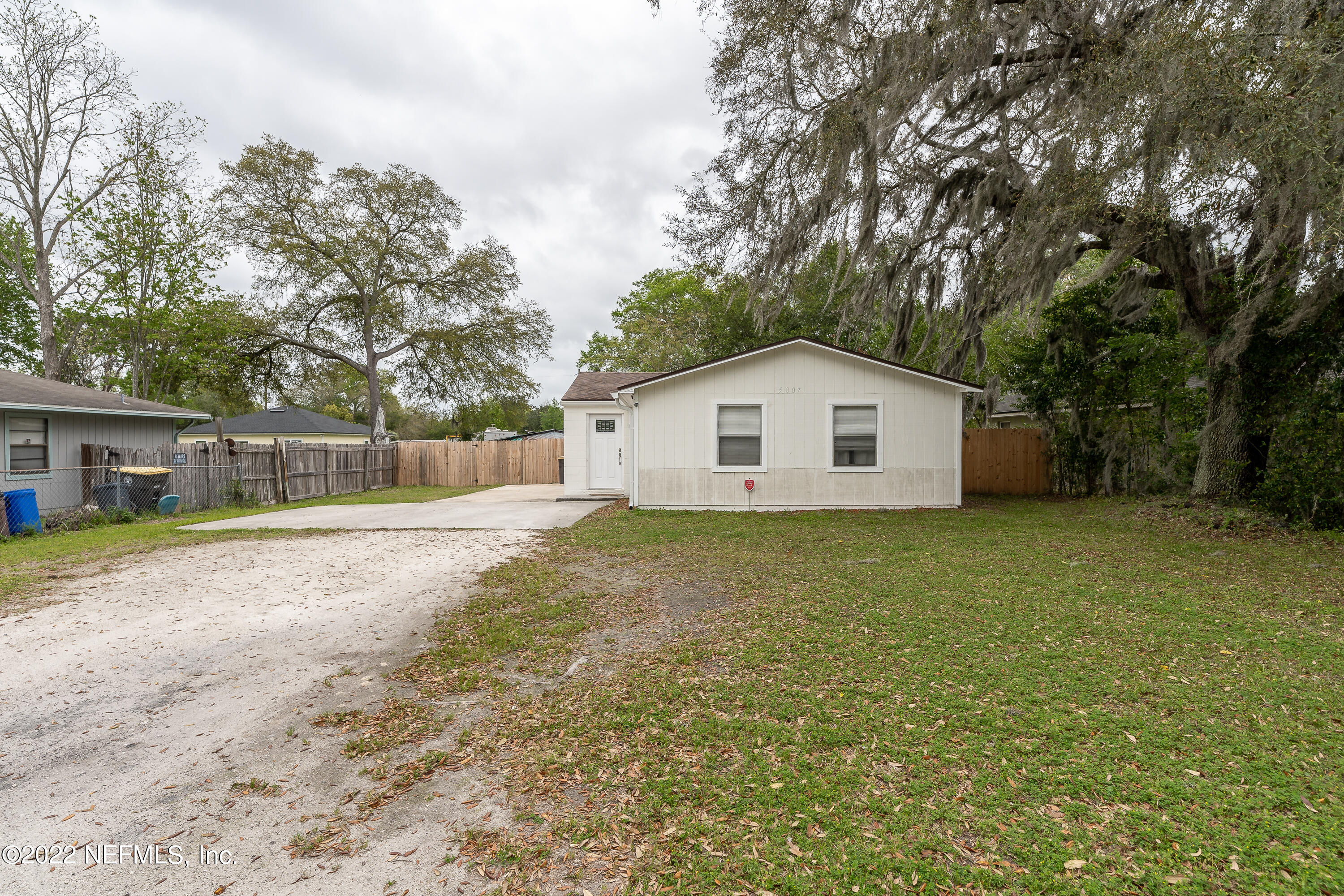 5807 Ricker Road Jacksonville, FL 32244 - Photo 3 of 31 a view of a house with a backyard