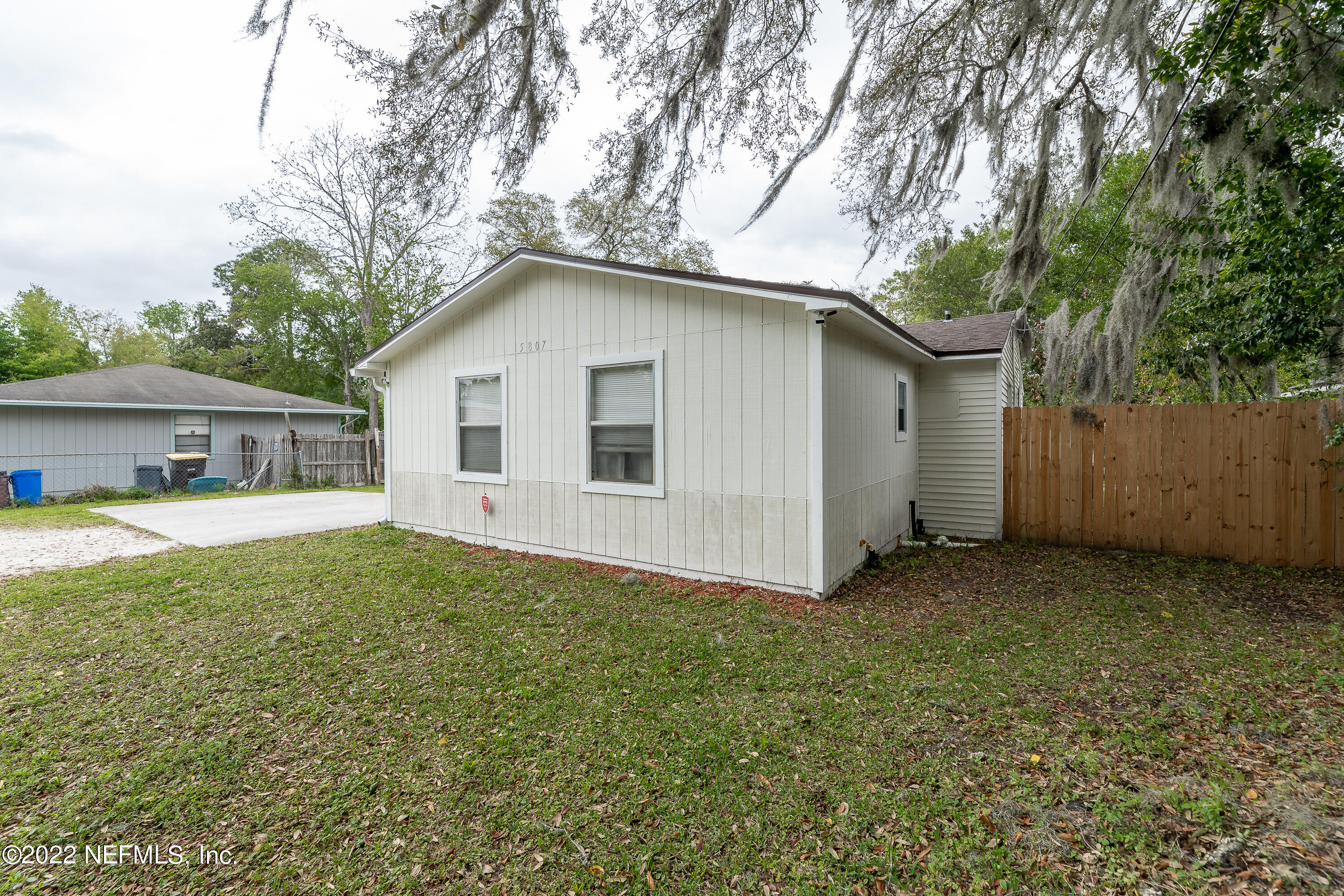 5807 Ricker Road Jacksonville, FL 32244 - Photo 7 of 31 a view of a house with a yard