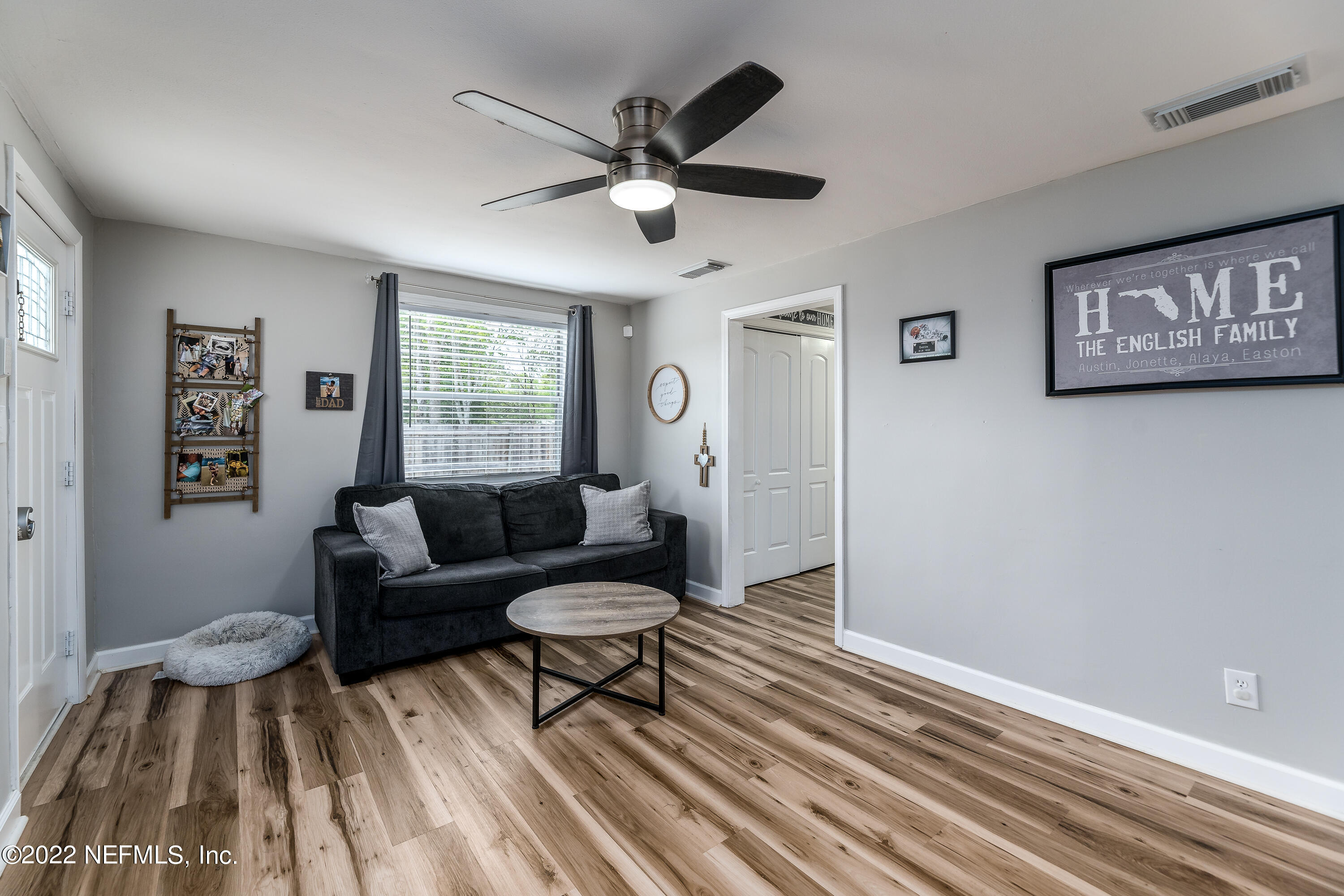 5807 Ricker Road Jacksonville, FL 32244 - Photo 9 of 31 a living room with furniture and a window