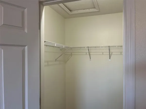 a view of a room with racks on the wall