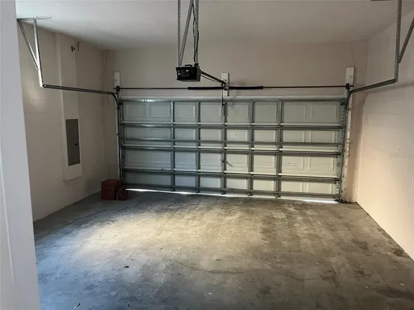 a view of a garage with wooden floor