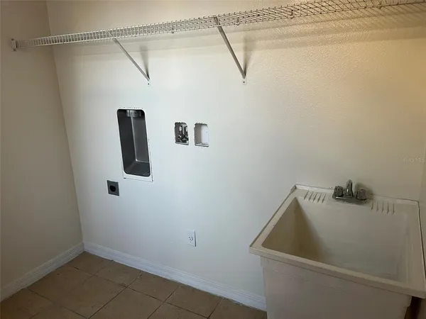a bathroom with a sink and shower