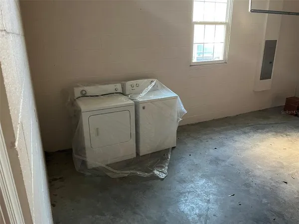 a utility room with dryer and washer