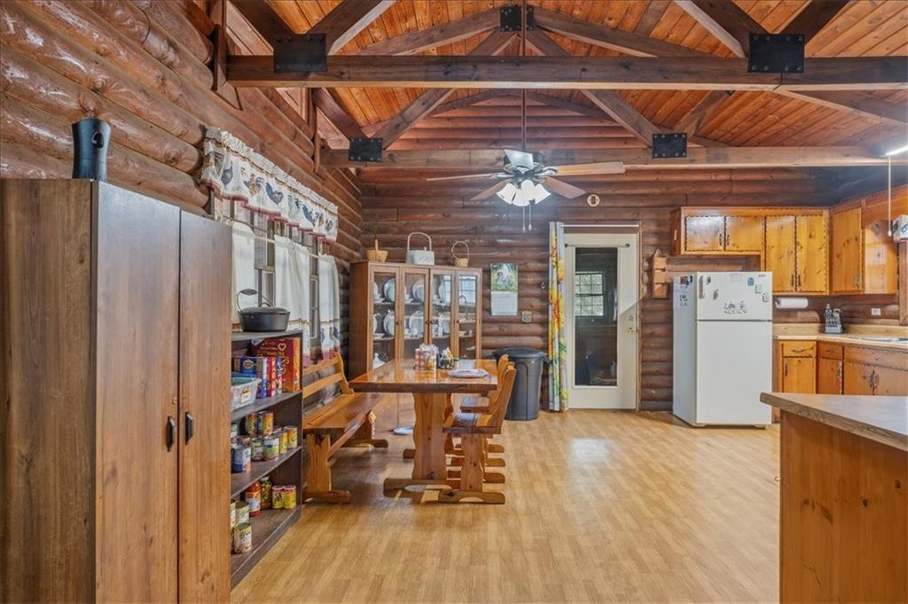 266 Anderson Road Rockmart, GA 30153 - Photo 15 of 31 a view of a kitchen with refrigerator and wooden floor