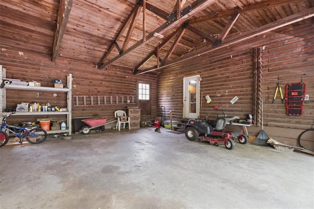 266 Anderson Road Rockmart, GA 30153 - Photo 16 of 31 a view of a garage with parked cars