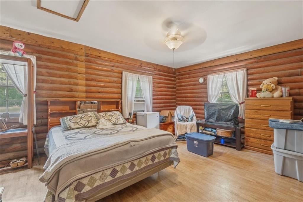 266 Anderson Road Rockmart, GA 30153 - Photo 19 of 31 a bedroom with a bed wooden floor and window
