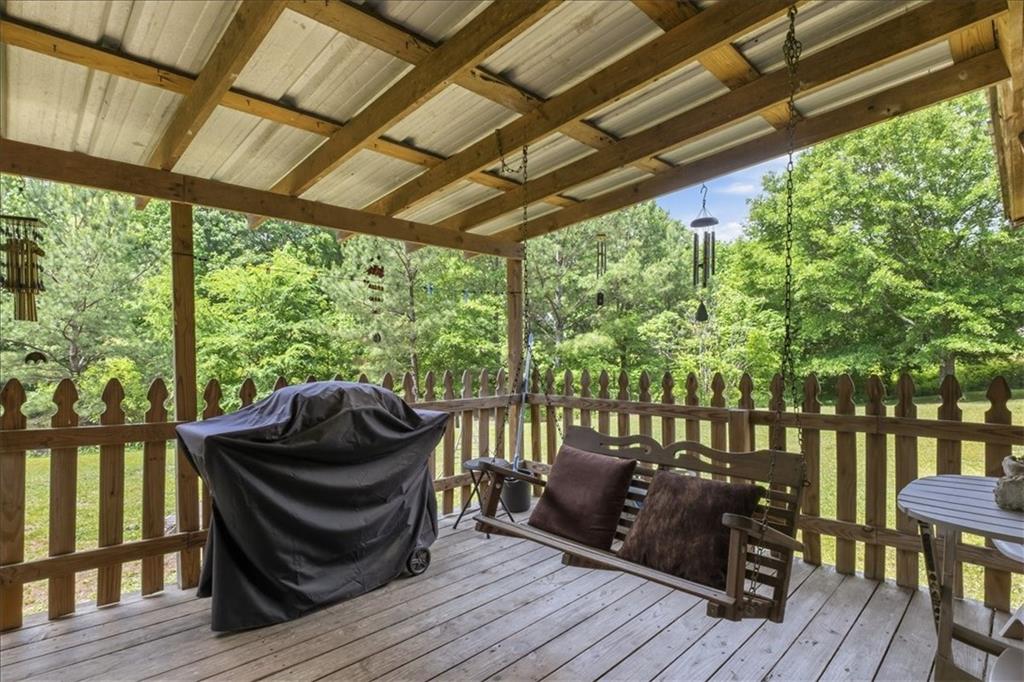 266 Anderson Road Rockmart, GA 30153 - Photo 23 of 31 a view of balcony with couch and wooden floor