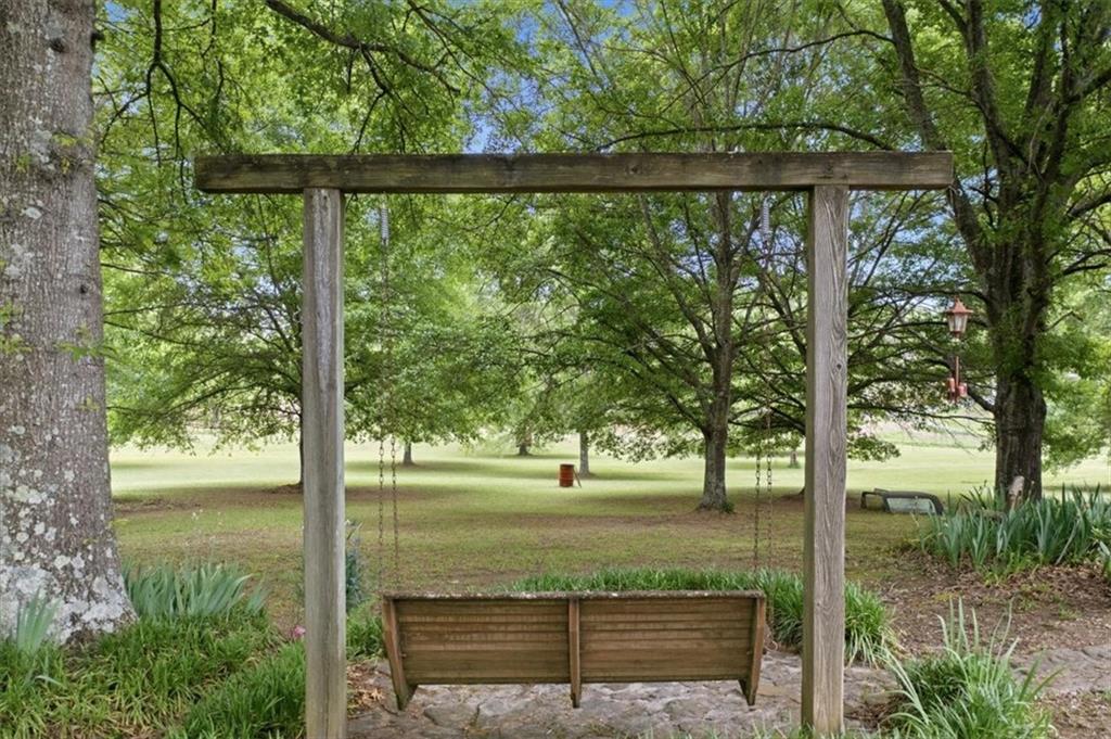 266 Anderson Road Rockmart, GA 30153 - Photo 26 of 31 a view of a backyard with large trees