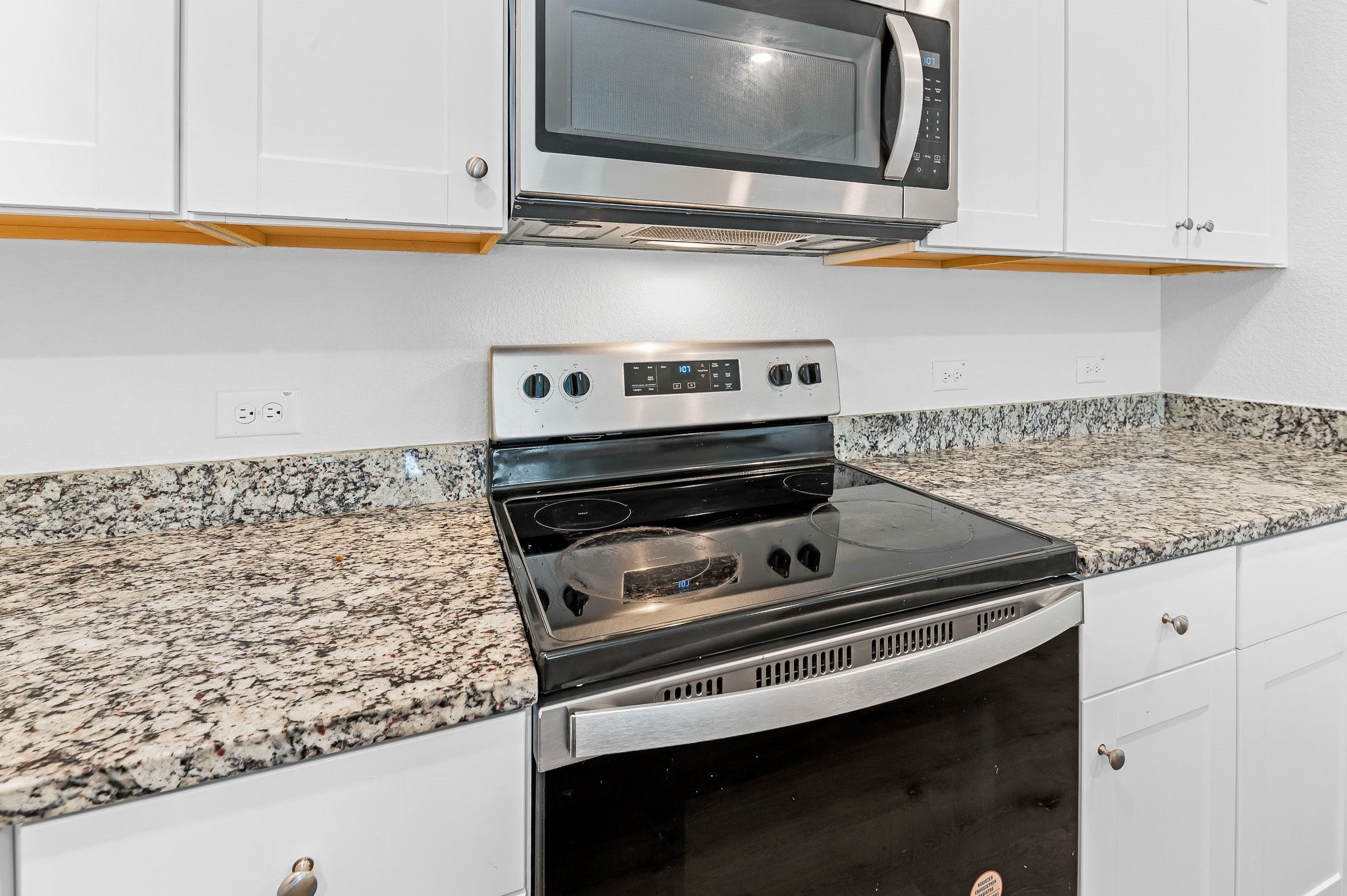 224 Night Riders Way Jarrell, TX 76537 - Photo 15 of 40 a stove top oven sitting inside of a kitchen