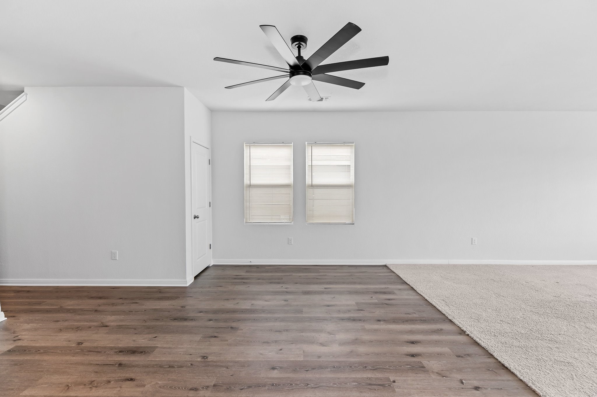 224 Night Riders Way Jarrell, TX 76537 - Photo 21 of 40 wooden floor in an empty room with a window