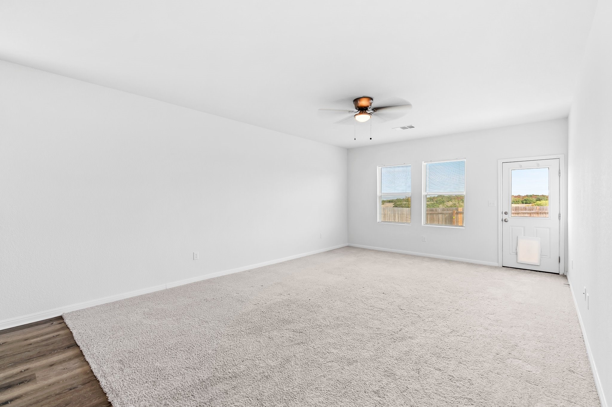 224 Night Riders Way Jarrell, TX 76537 - Photo 22 of 40 an empty room with windows and couch