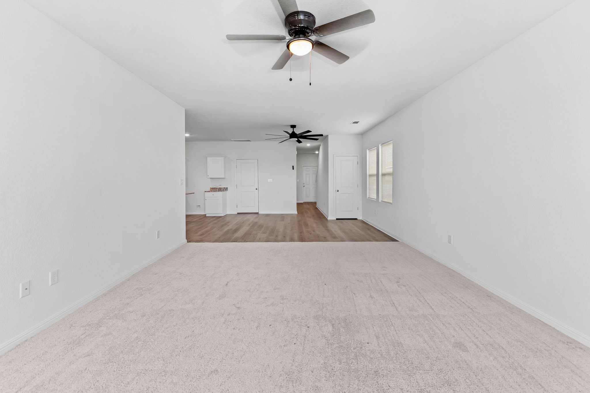 224 Night Riders Way Jarrell, TX 76537 - Photo 24 of 40 en empty room with ceiling fan and window