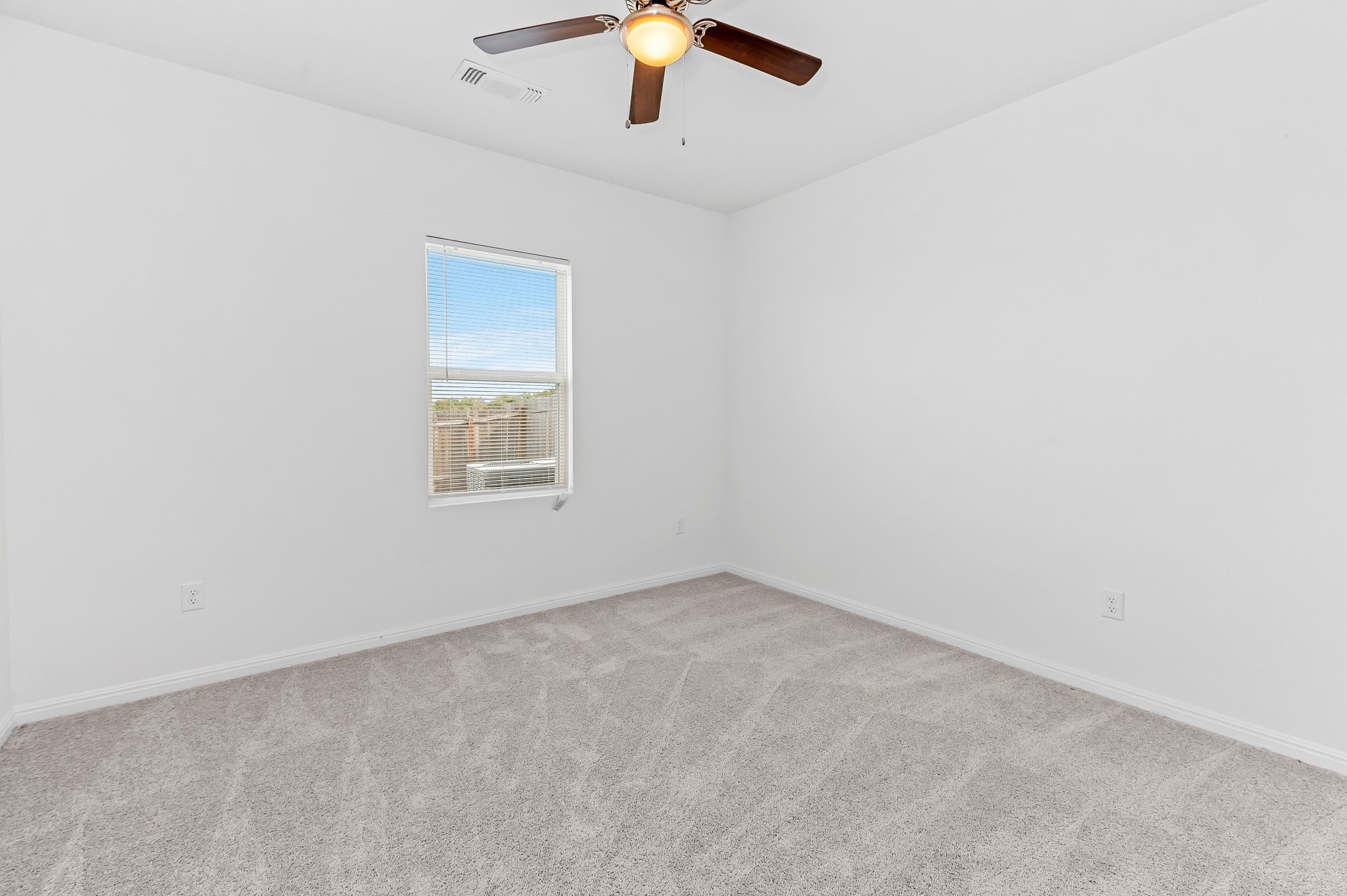 224 Night Riders Way Jarrell, TX 76537 - Photo 25 of 40 an empty room with a ceiling fan and window