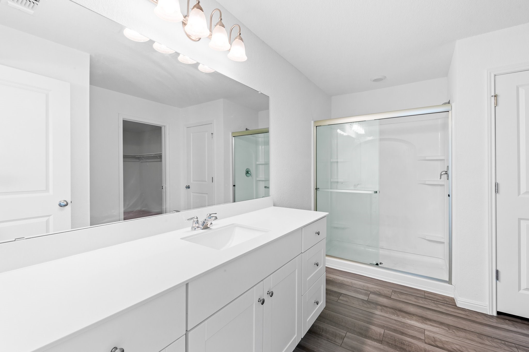 224 Night Riders Way Jarrell, TX 76537 - Photo 33 of 40 a bathroom with a sink a shower and a mirror