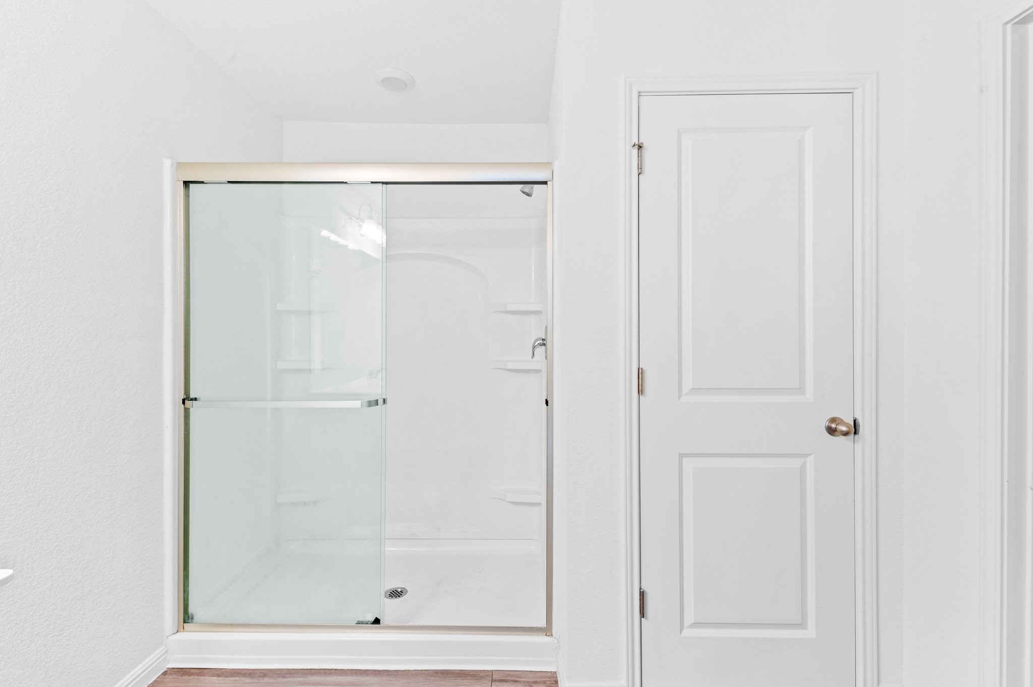 224 Night Riders Way Jarrell, TX 76537 - Photo 34 of 40 a bathroom with a glass shower door