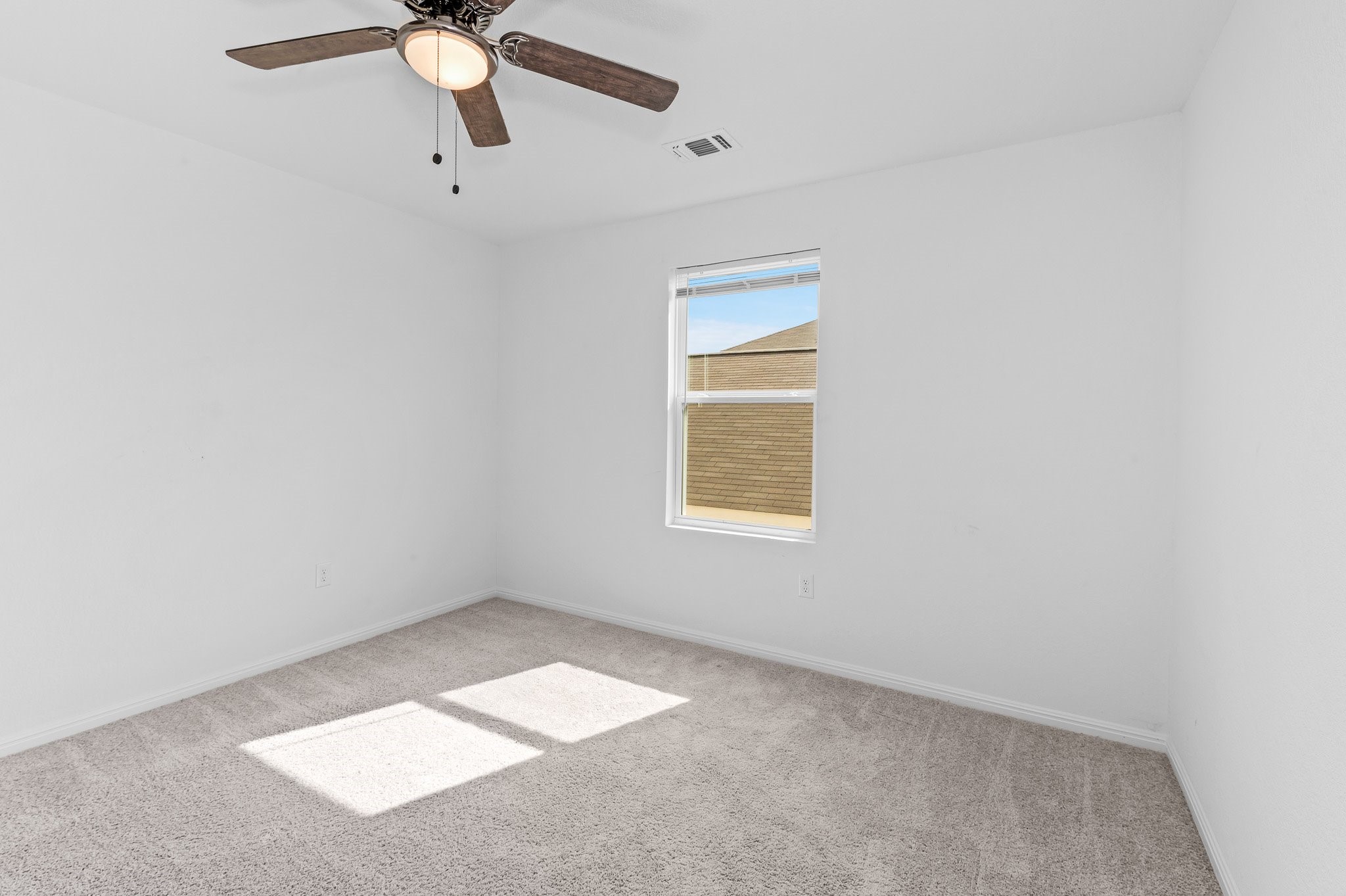 224 Night Riders Way Jarrell, TX 76537 - Photo 37 of 40 an empty room with windows and fan