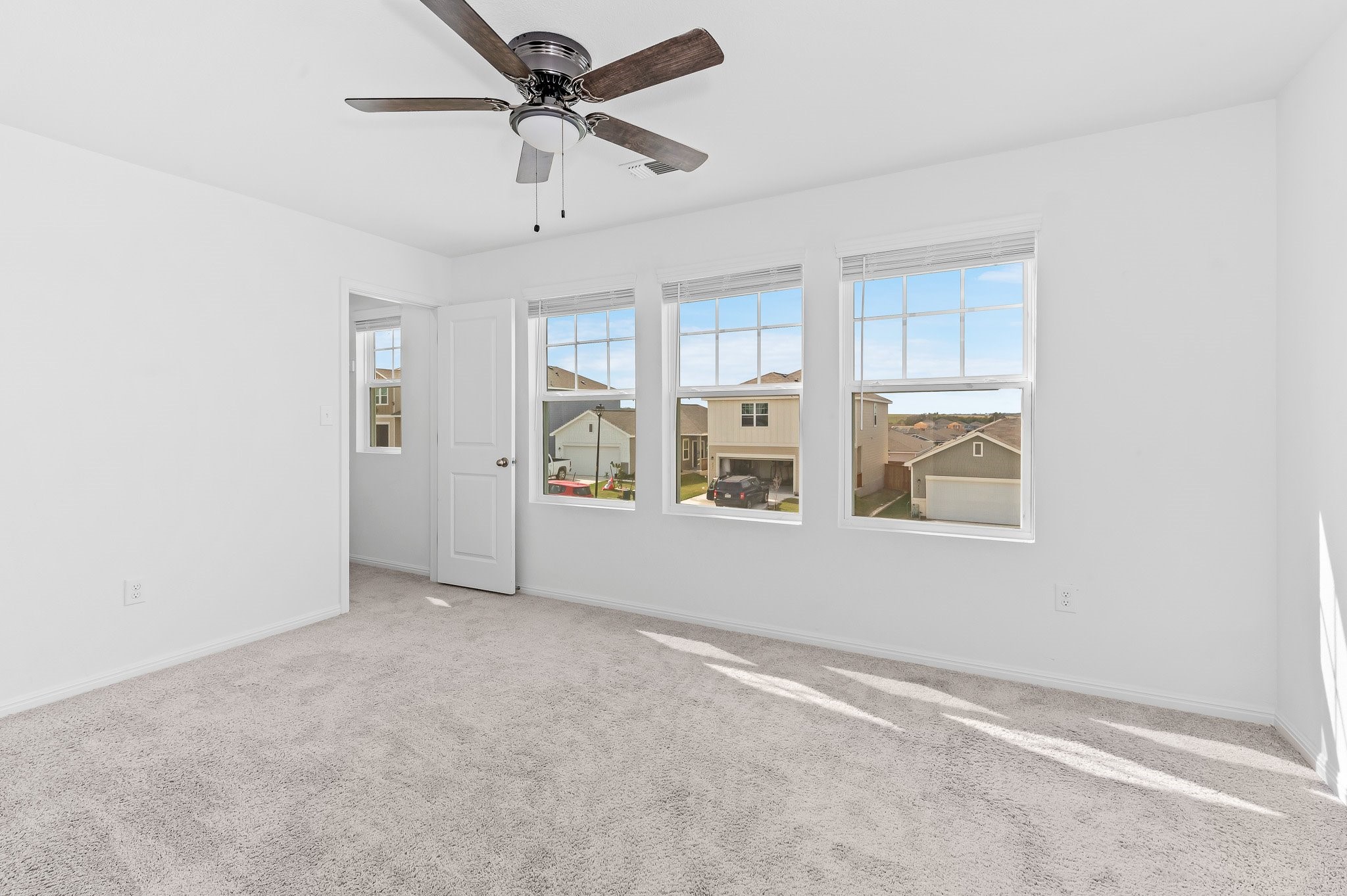 224 Night Riders Way Jarrell, TX 76537 - Photo 40 of 40 an empty room with windows and fan