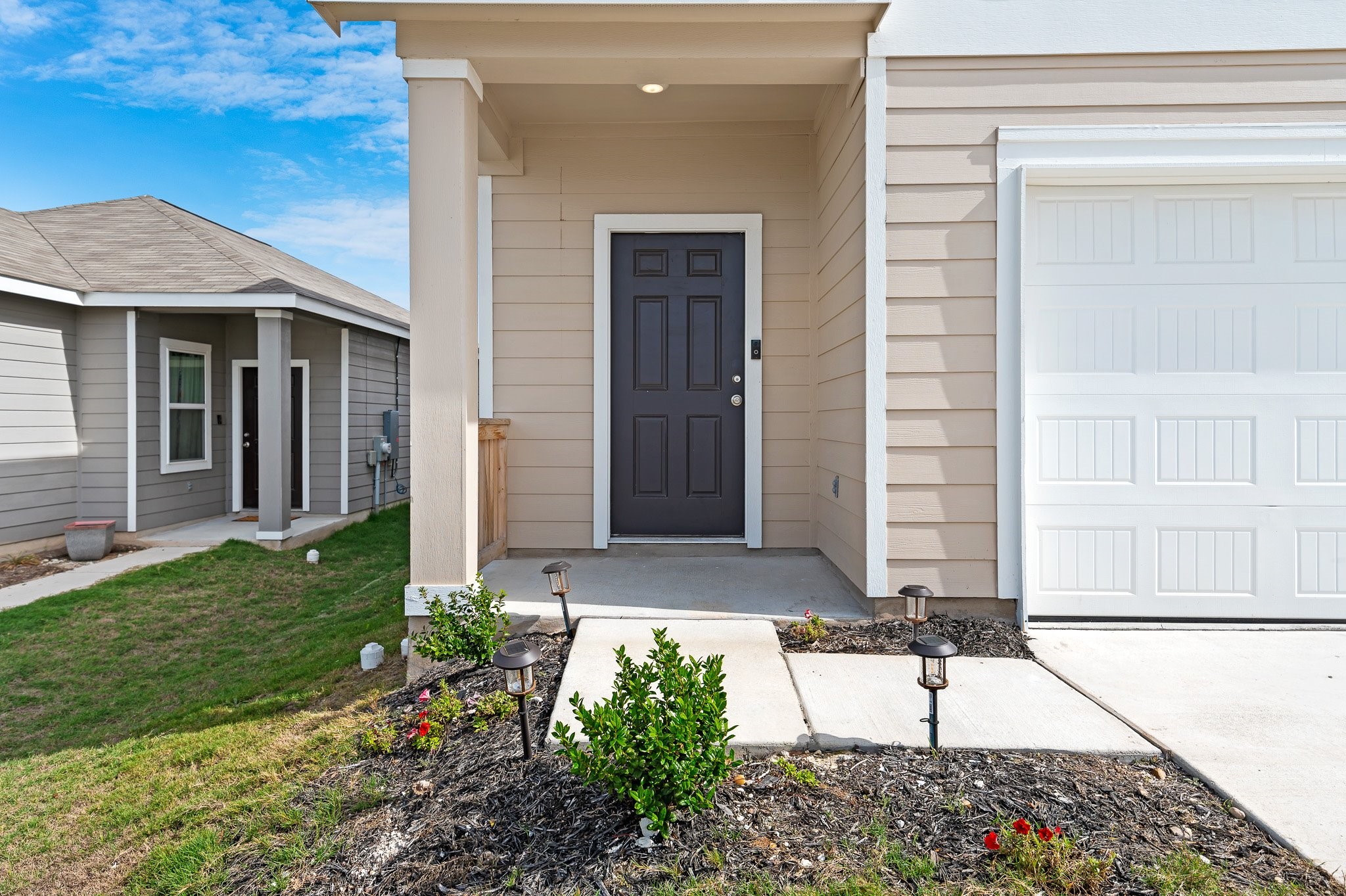 224 Night Riders Way Jarrell, TX 76537 - Photo 4 of 40 a front view of a house with garden