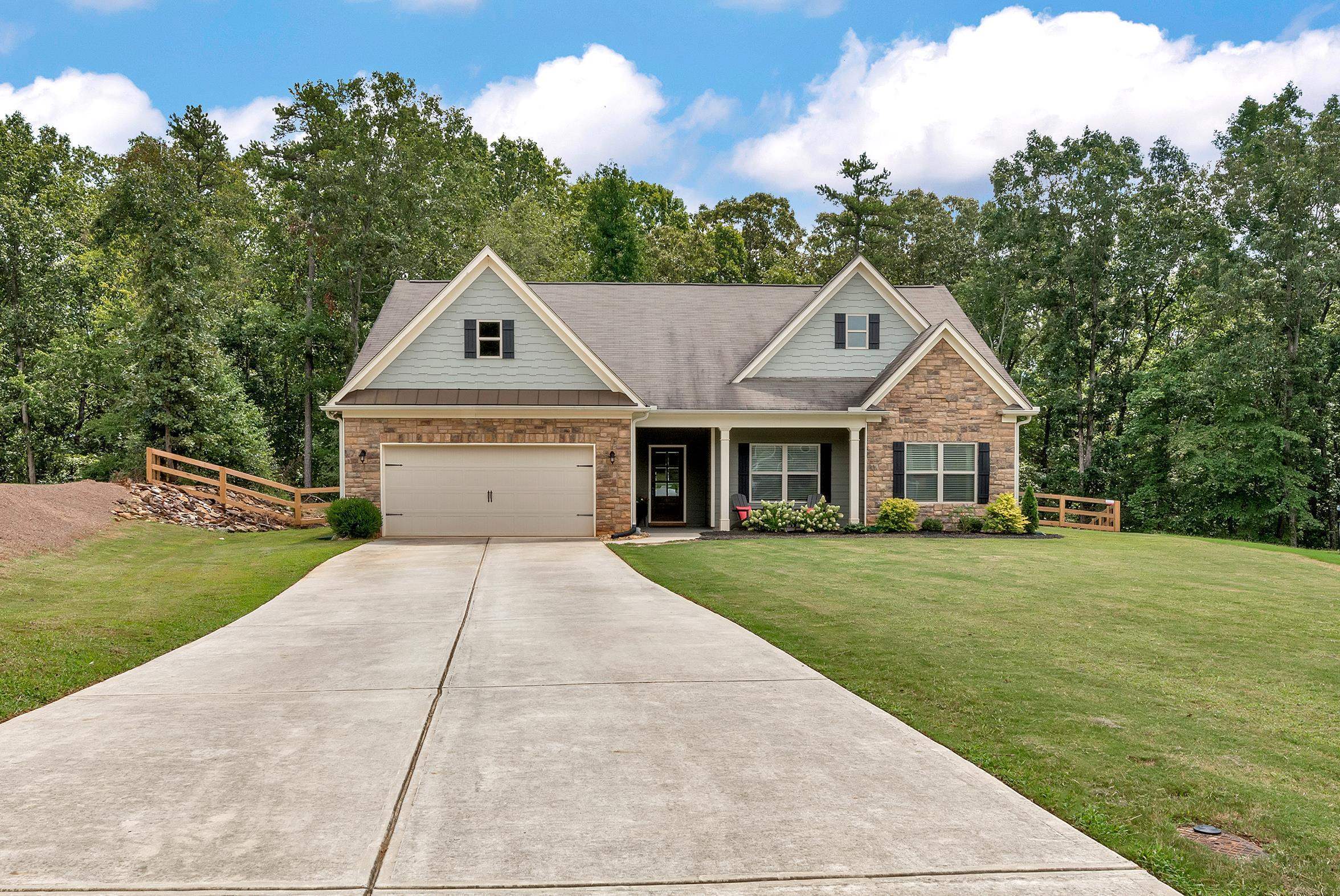 1412 Shadowstone Drive Winder, GA 30680 - Photo 1 of 1 a front view of a house with a yard