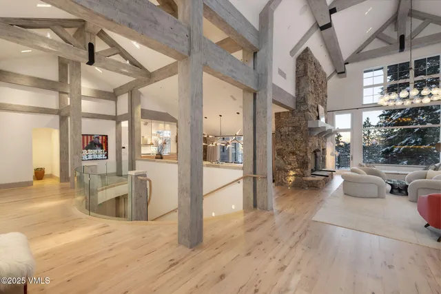 a bedroom with a bed couch and a large window