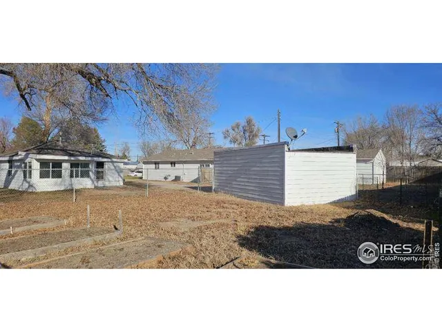 a view of kitchen and an empty room