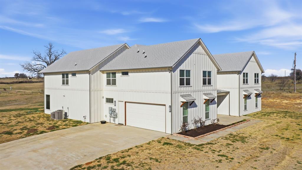 4600 B Old Brock Road Weatherford, TX 76087 - Photo 4 of 40 View of property exterior featuring a garage, driveway, and a shingled roof