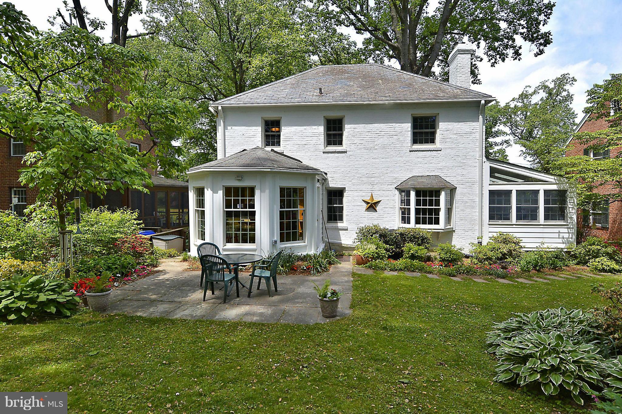 510 Ashford Road Silver Spring, MD 20910 - Photo 2 of 30 a front view of a house with a yard table and chairs