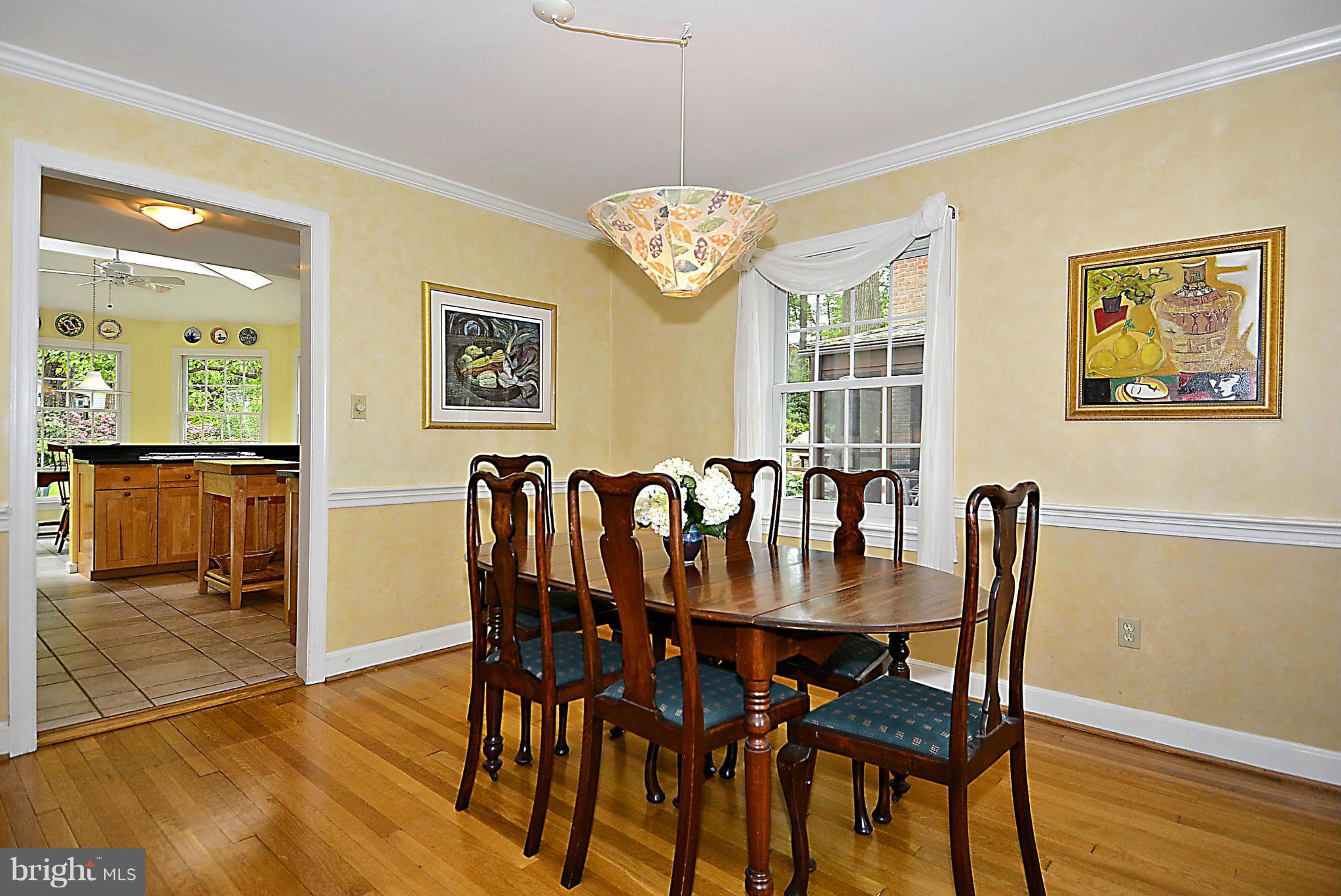 510 Ashford Road Silver Spring, MD 20910 - Photo 12 of 30 a view of a dining room with furniture and wooden floor